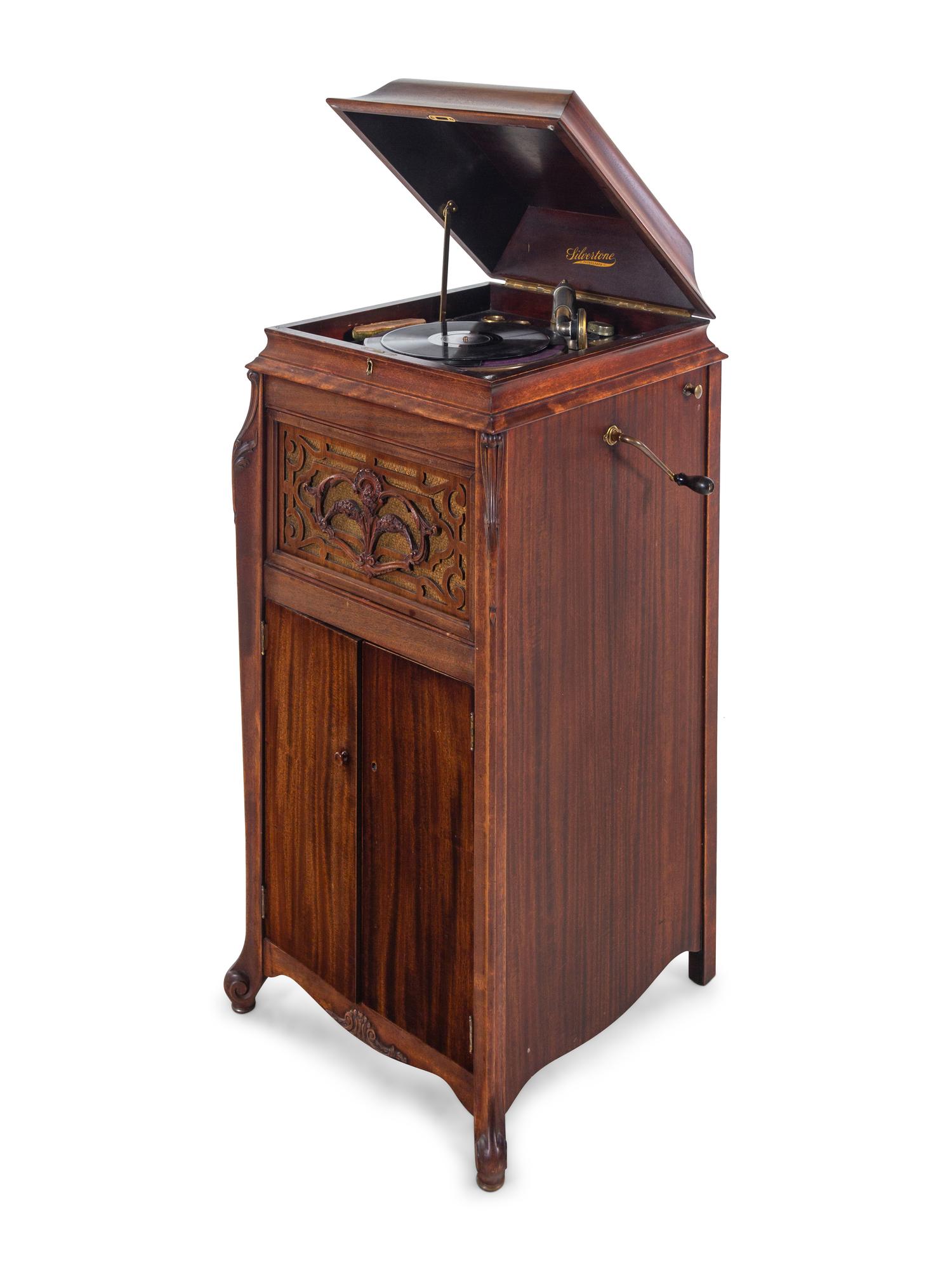 A Silvertone Carved and Stained Wood Tall Case Phonograph