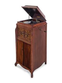 A Silvertone Carved and Stained Wood Tall Case Phonograph
