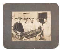 [MCKINLEY, William]. 2 photos of the dissection of the body of Czolgosz's apprehender. Ca 1908.
