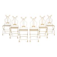A Set of Six Neoclassical Style Cream-Painted and Parcel Gilt Garden Chairs
