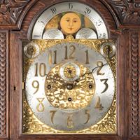 A Renaissance Revival Carved Oak Tall Case Clock