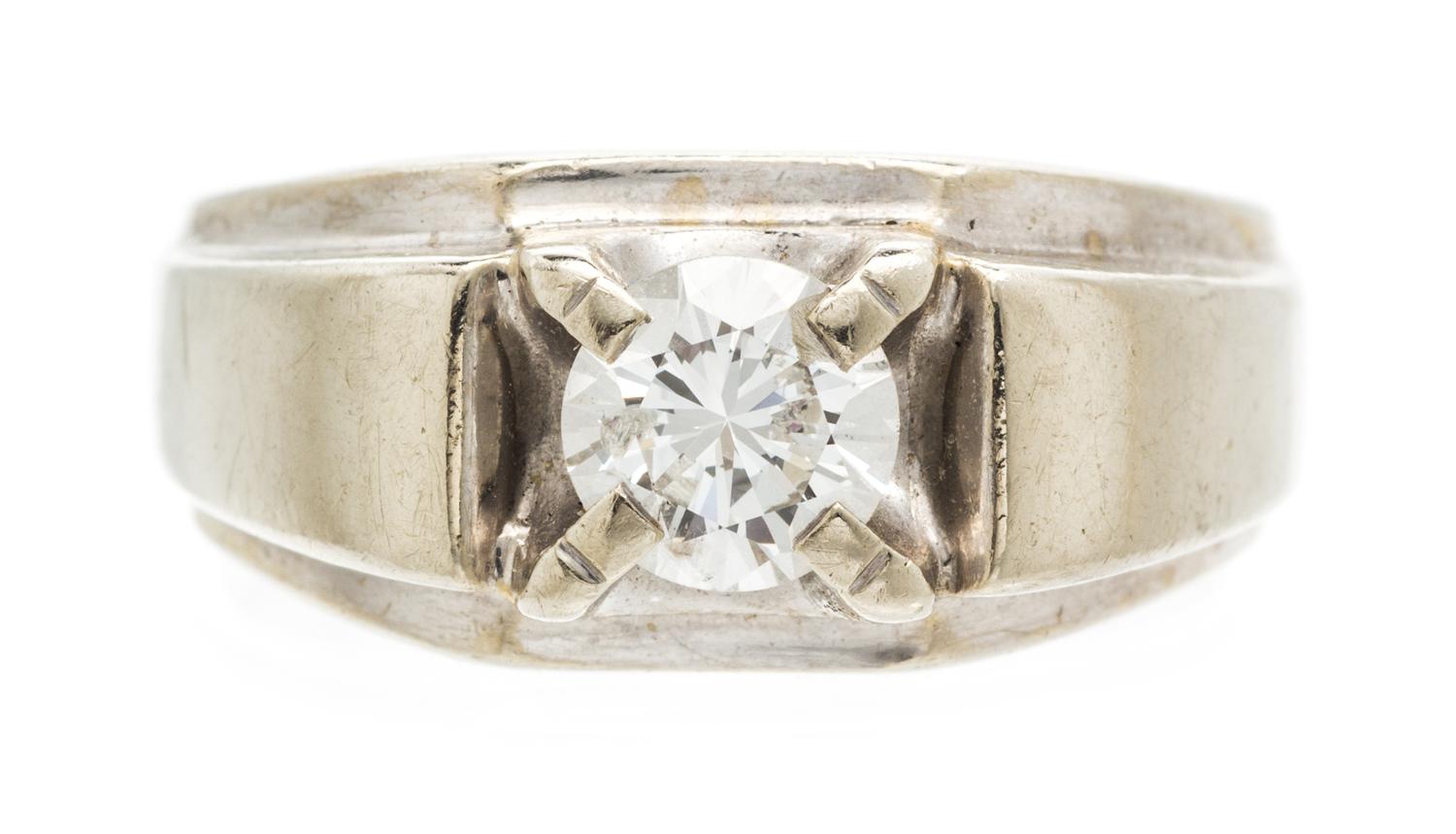 A 14 Karat White Gold and Diamond Ring, 5.40 dwts.