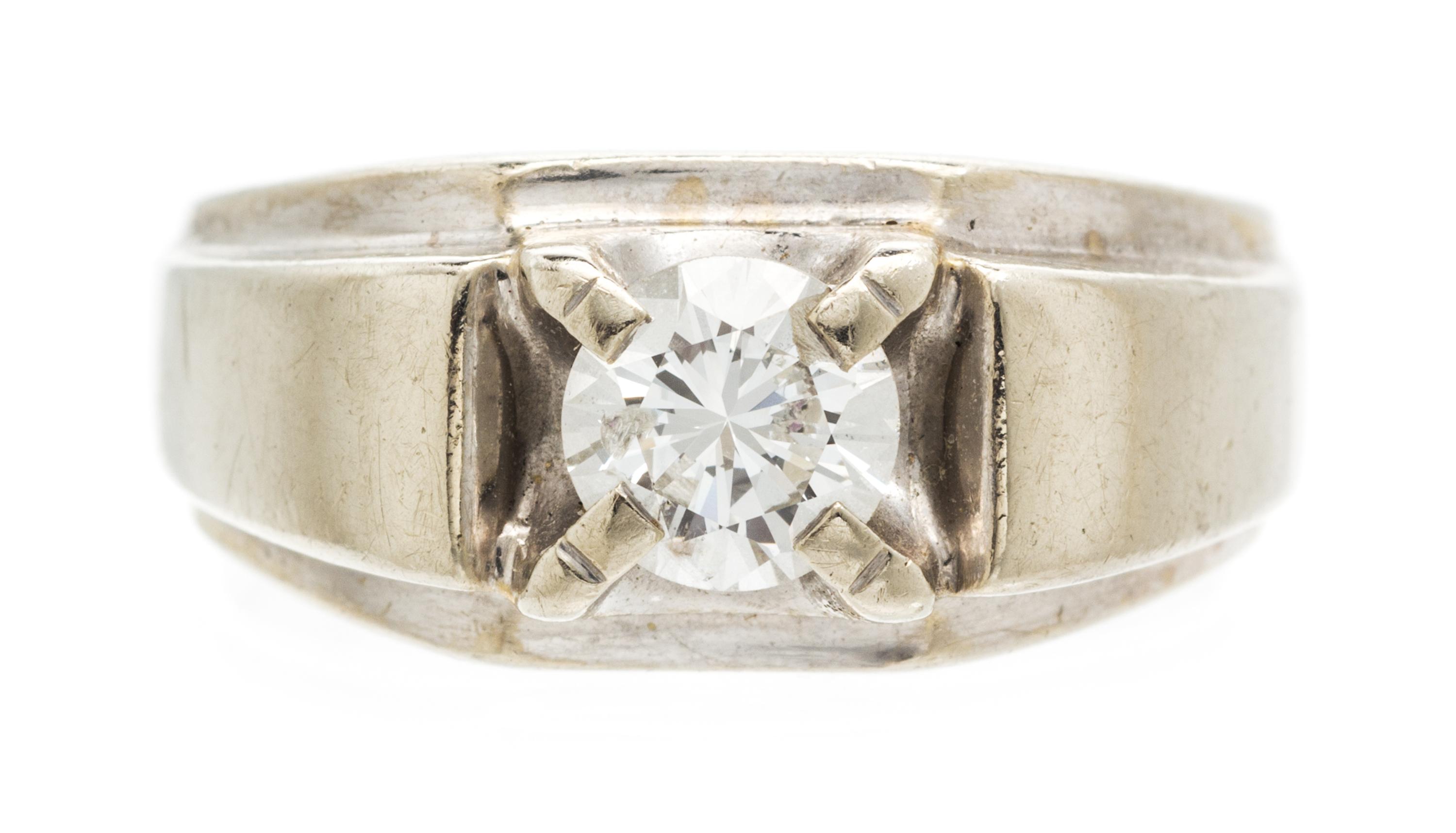 A 14 Karat White Gold and Diamond Ring, 5.40 dwts.