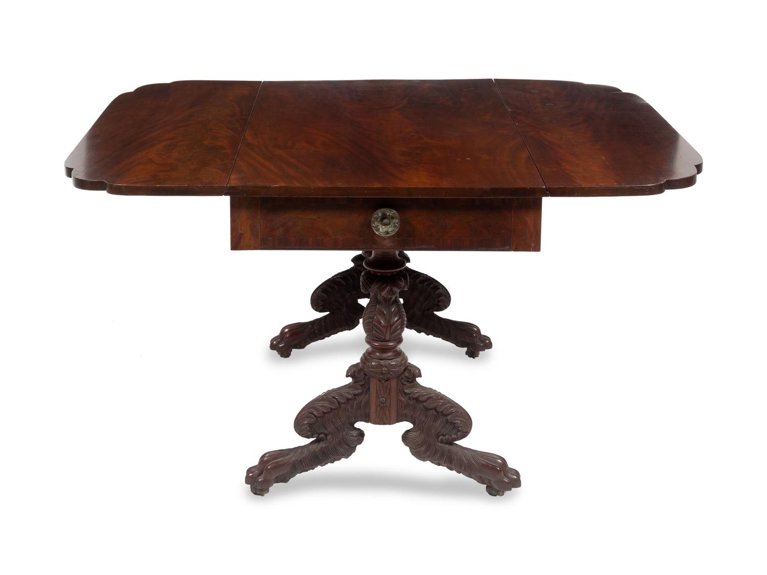 A Classical Carved and Figured Mahogany Drop-Leaf Table