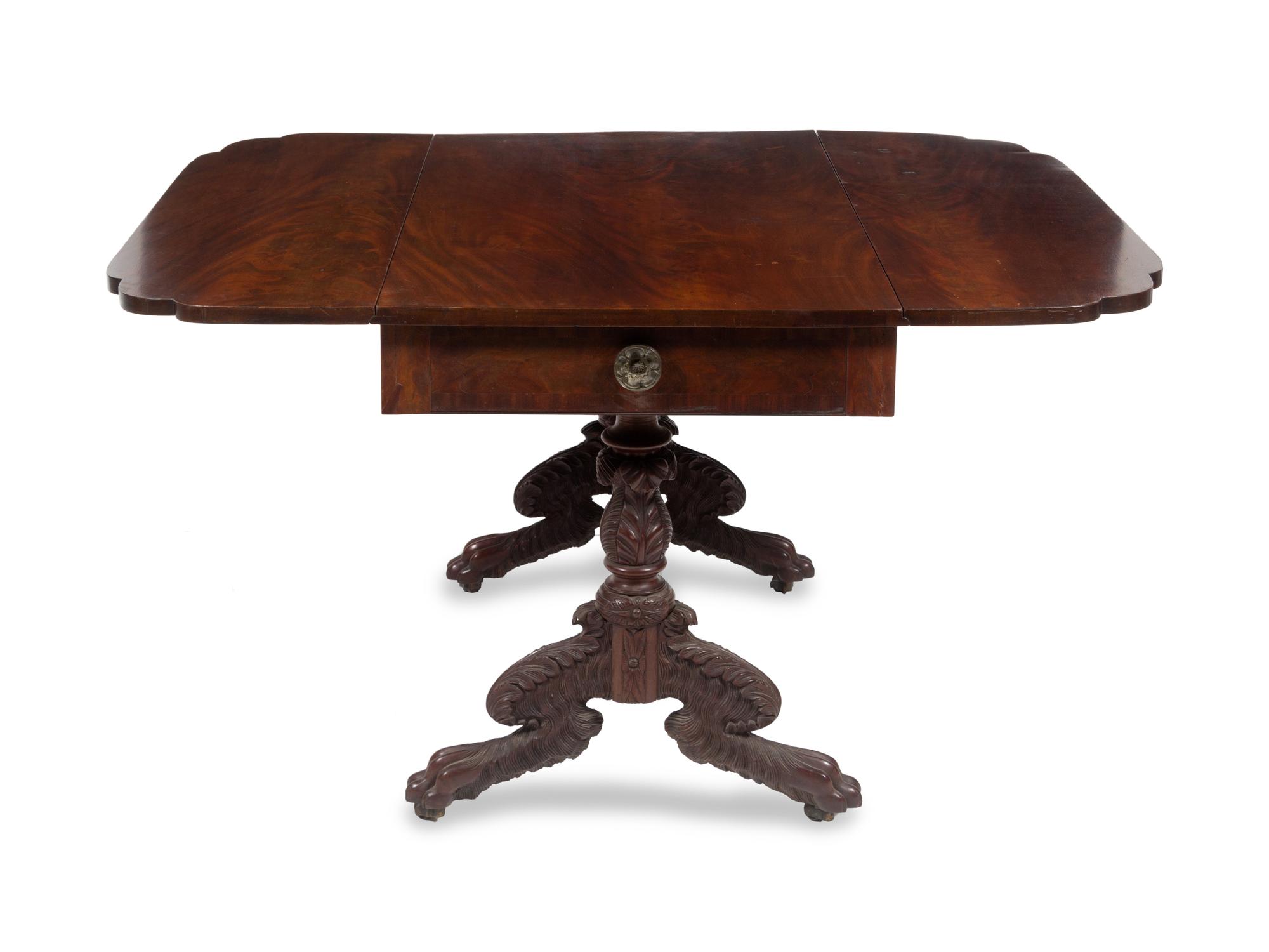 A Classical Carved and Figured Mahogany Drop-Leaf Table