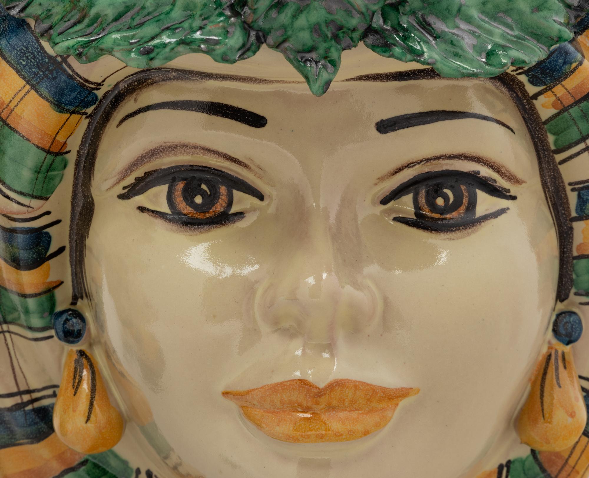 A Pair of Italian Polychrome Glazed Pottery Figural Vases