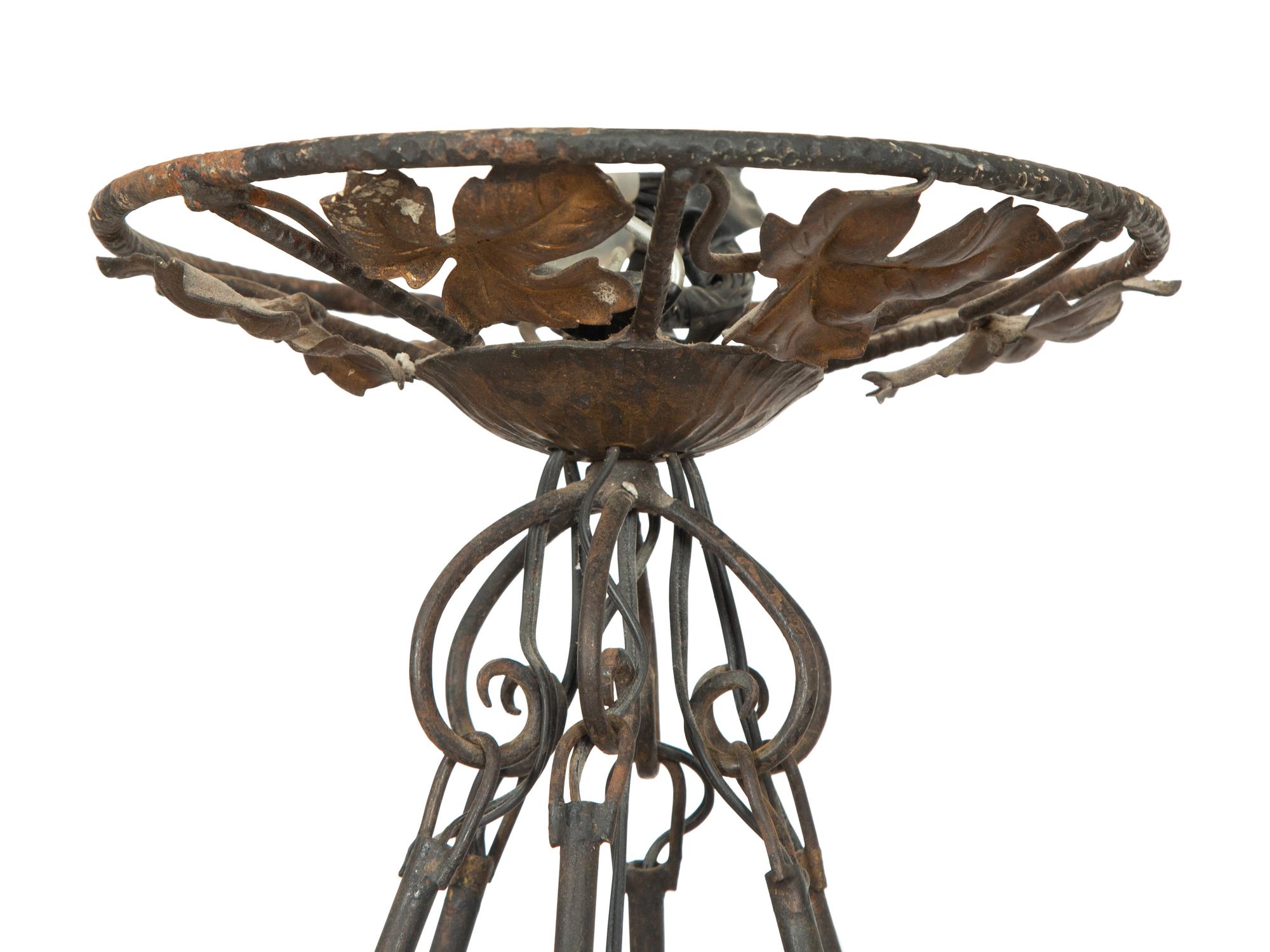 An Art Deco Wrought Iron and Glass Chandelier by Degue
