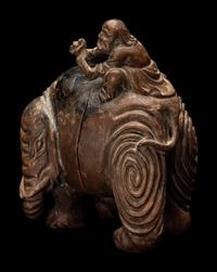 A Chinese Carved Wood 'Foreigner and Elephant' Figural Group