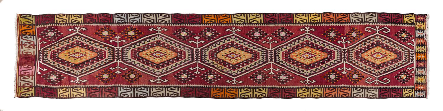 A Kilim Wool Runner 14 feet 7 1/2 inches x 3 feet 7 1/2 inches.