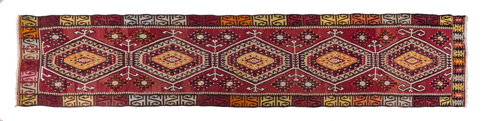 A Kilim Wool Runner 14 feet 7 1/2 inches x 3 feet 7 1/2 inches.