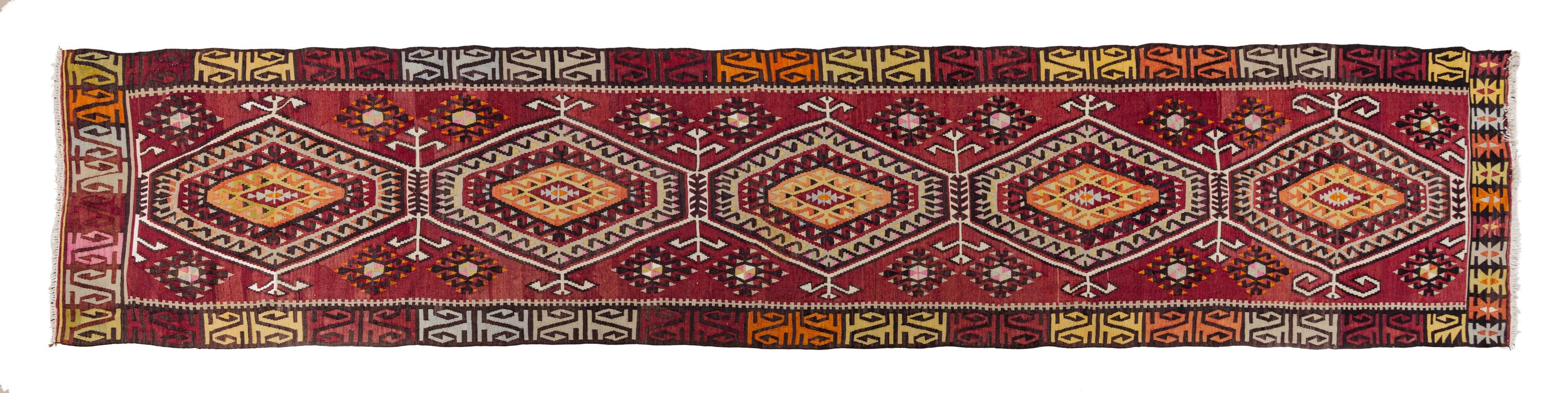 A Kilim Wool Runner 14 feet 7 1/2 inches x 3 feet 7 1/2 inches.