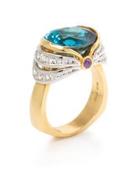 An 18 Karat Yellow Gold, Platinum, Blue Zircon, Diamond, and Pink Sapphire Ring, Krementz, 10.00 dwts.