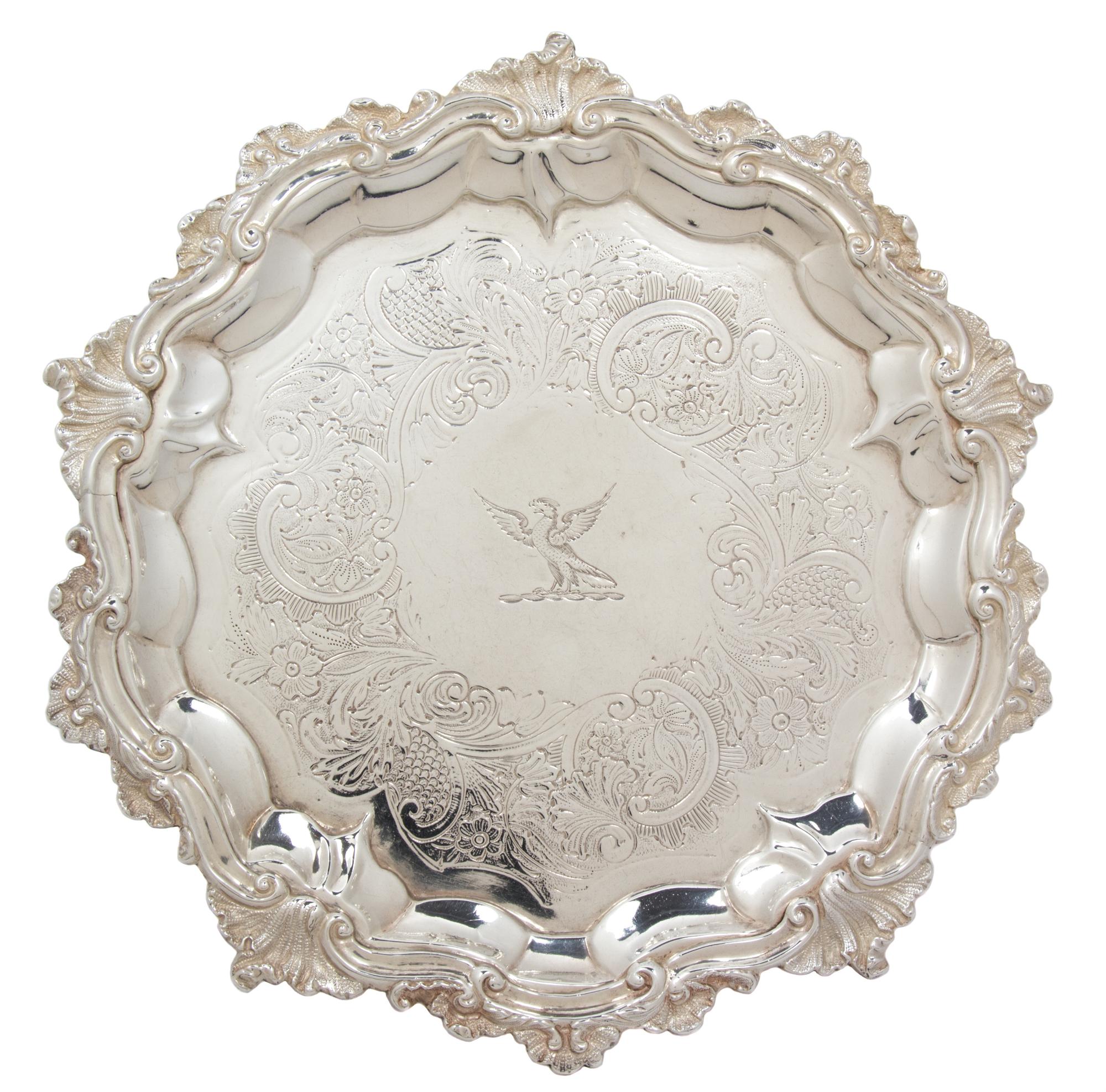 A William IV Silver Salver, Probably John Welby, London, 1834, with rocaille and C-scroll borders around an engraved band enclosing a b