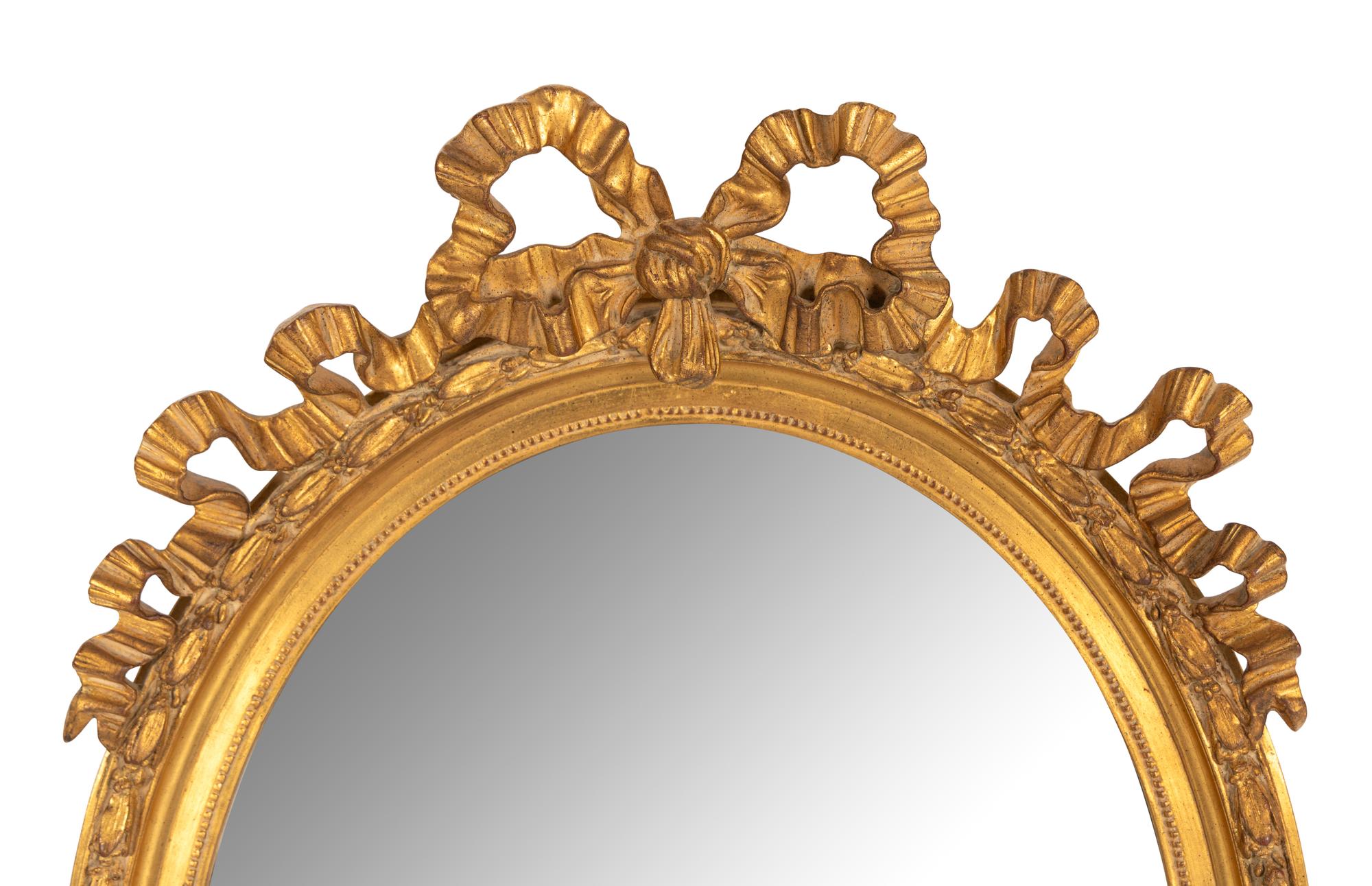 A Louis XVI Style Ribbon Decorated Parcel Gilt Mirror