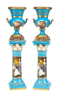 A Pair of Large Gilt Bronze Mounted Sevres Style Porcelain Urns with Pedestals Height of urn 24 1/2 inches; height of pedestal 36 inche