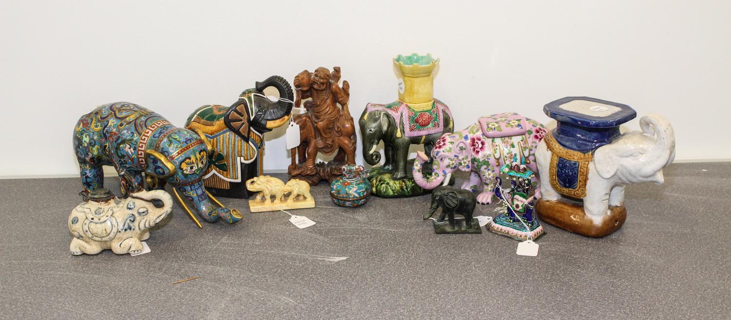 A Collection of Eleven Chinese Elephant Figures Height of tallest 8 1/2 inches.