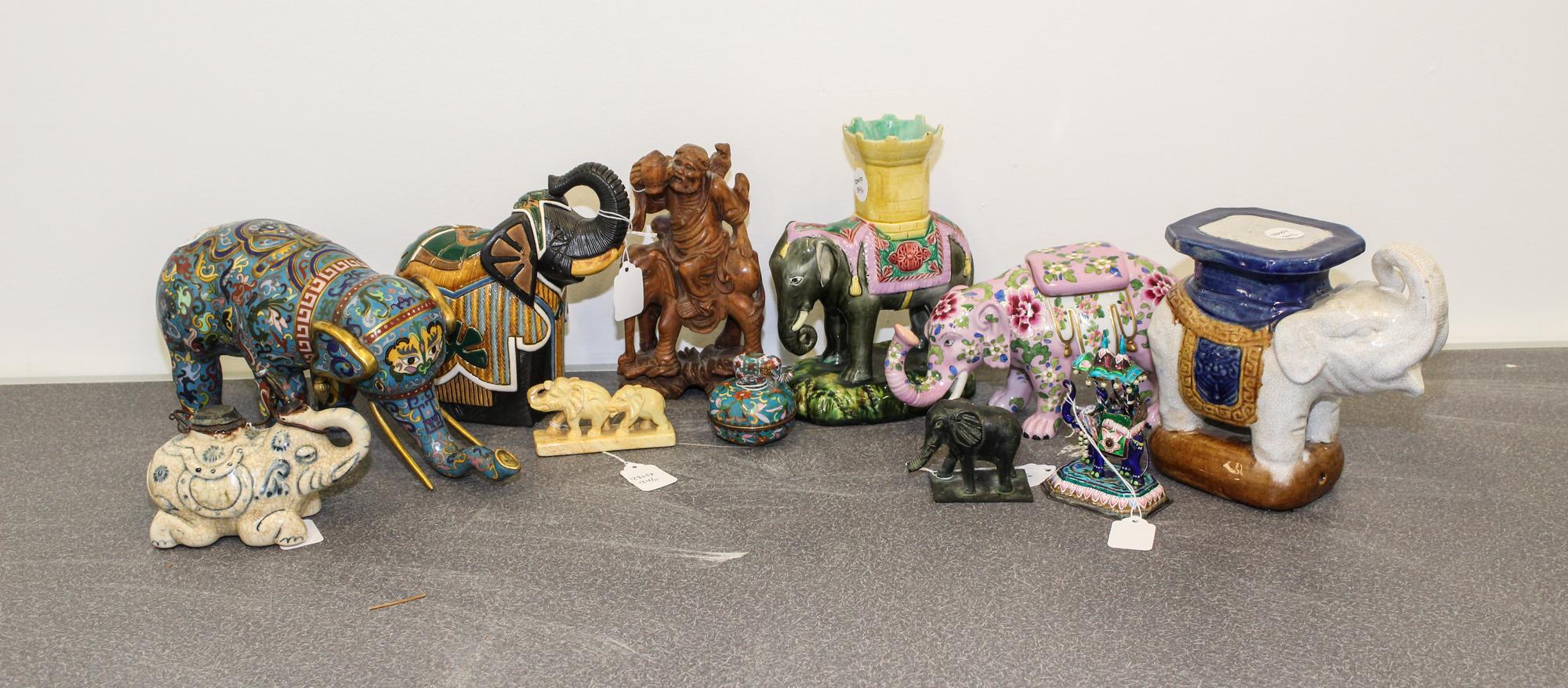 A Collection of Eleven Chinese Elephant Figures Height of tallest 8 1/2 inches.