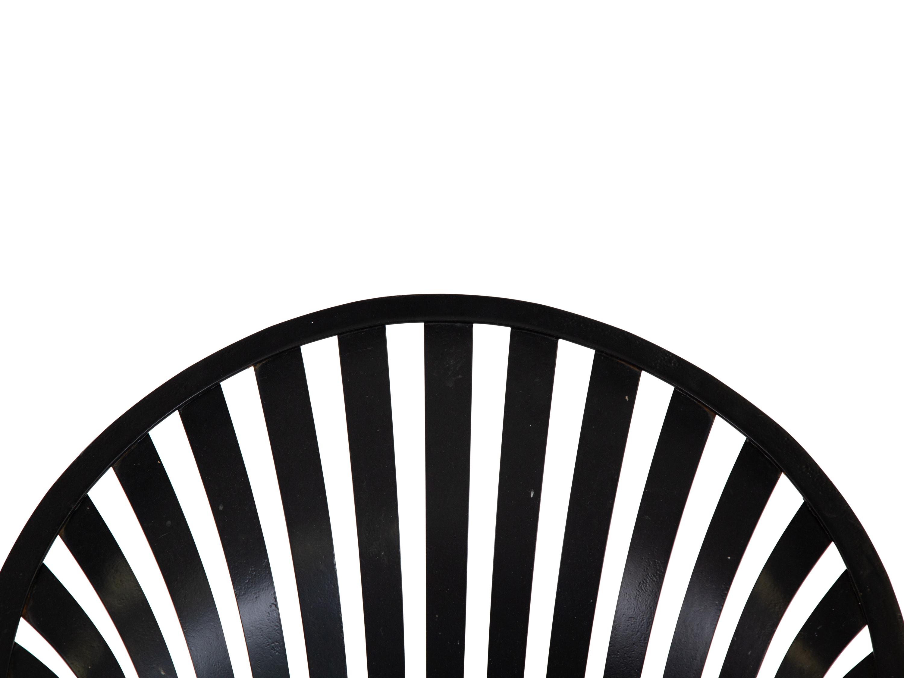A Spring Steel Garden Table and Eight Chairs by Francois Carre