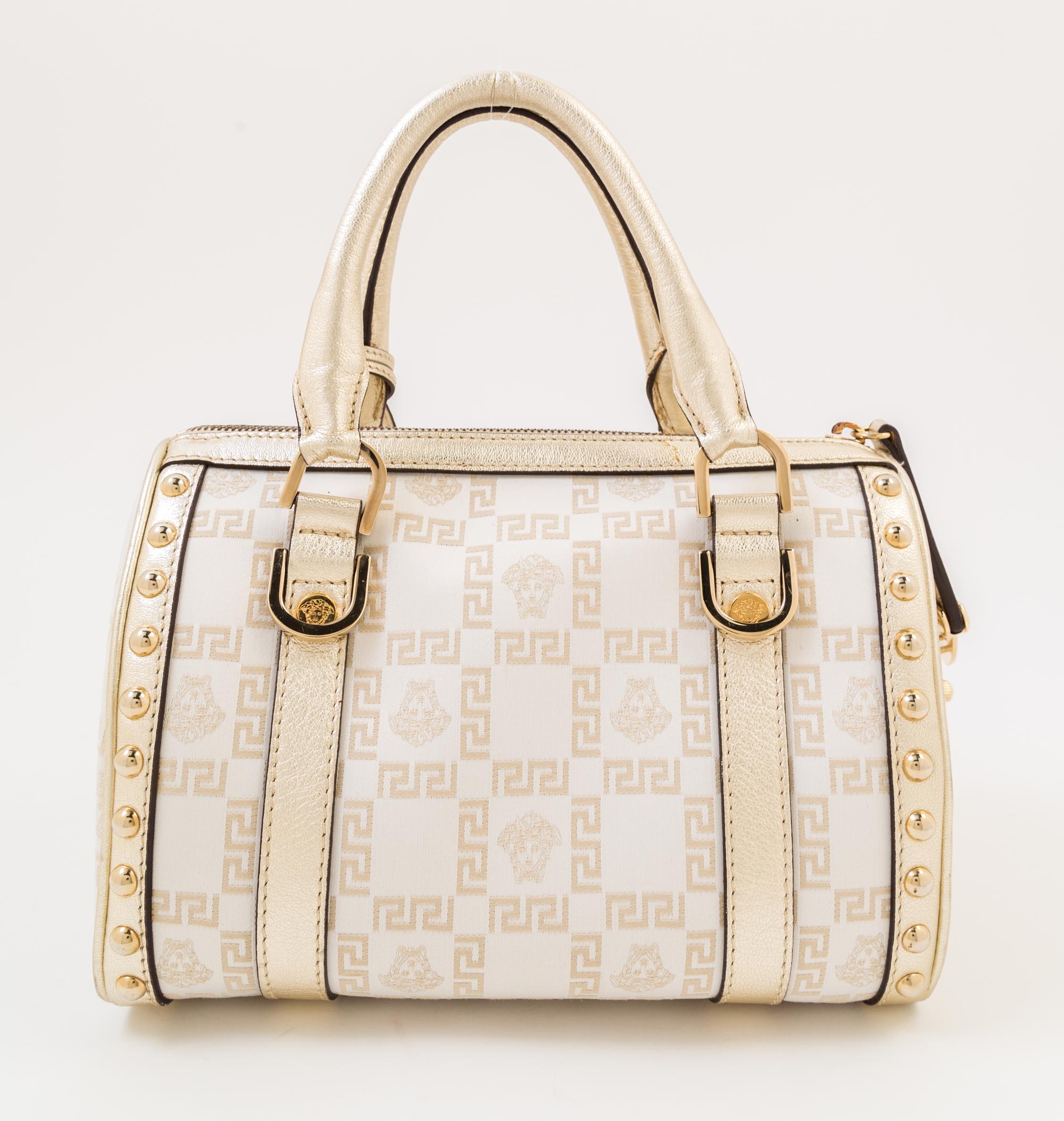 A Versace Metallic and Cream Monogram Handbag, 9.5" x 7" x 6"; Strap drop: 4".