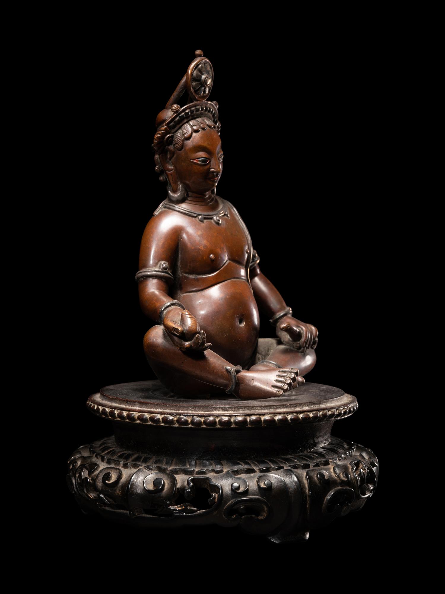 A Nepalese Bronze and Silver Figure of Seated Kubera