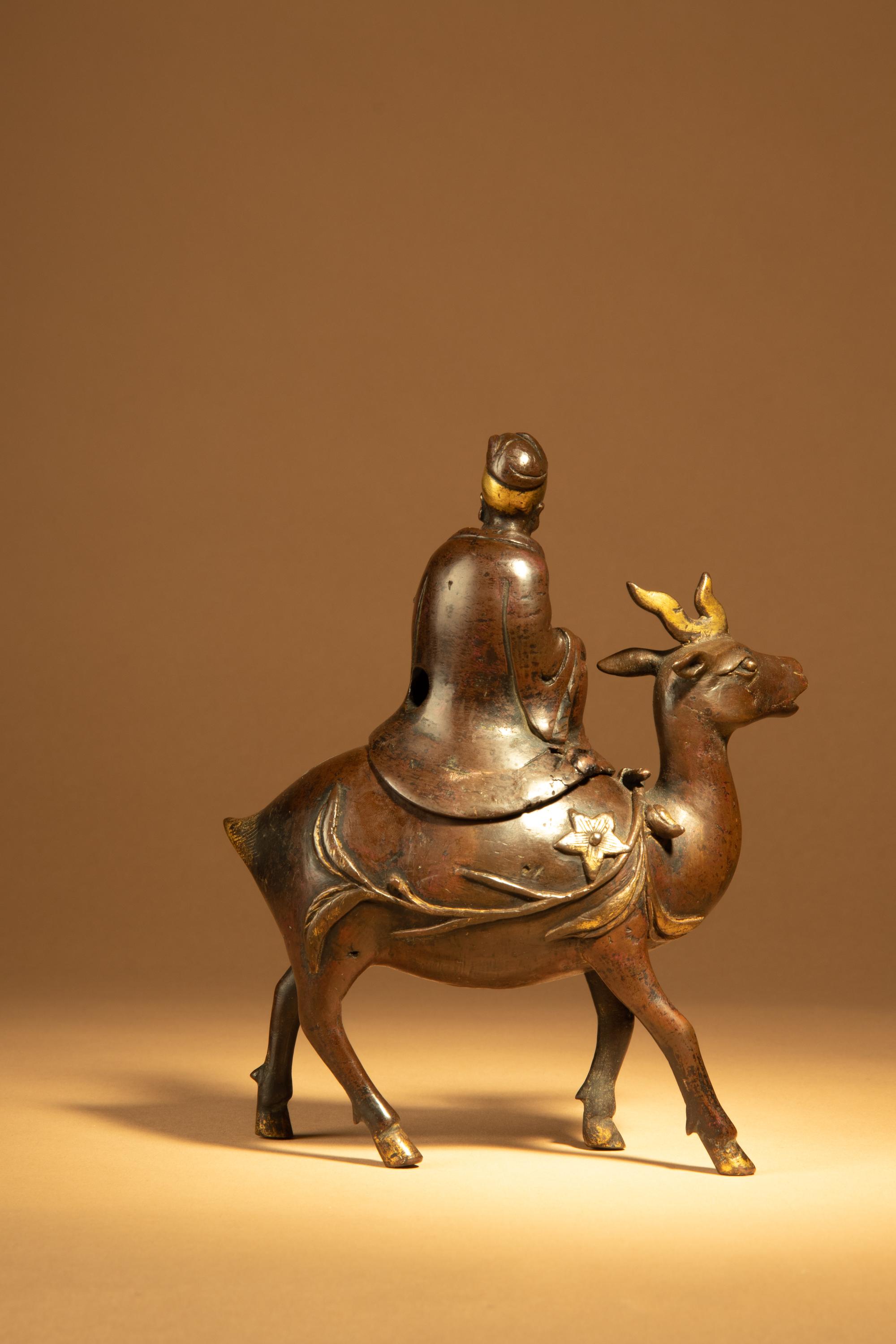 A Parcel-Gilt Bronze Figural-Form Incense Burner