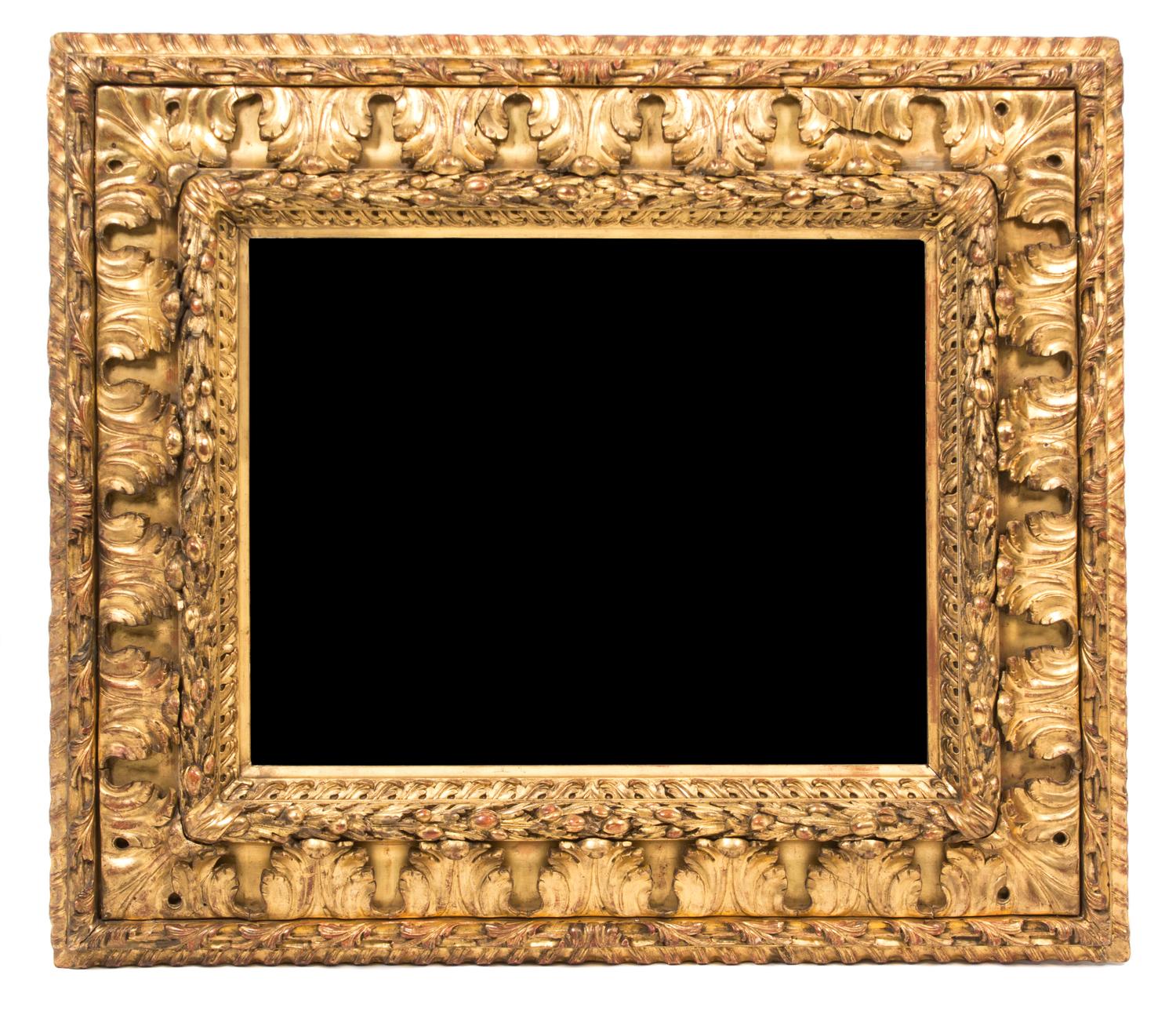 An Italian Carved Giltwood Mirror Height 31 x width 35 1/4 inches, mirror 19 1/2 x 24 3/4 inches.