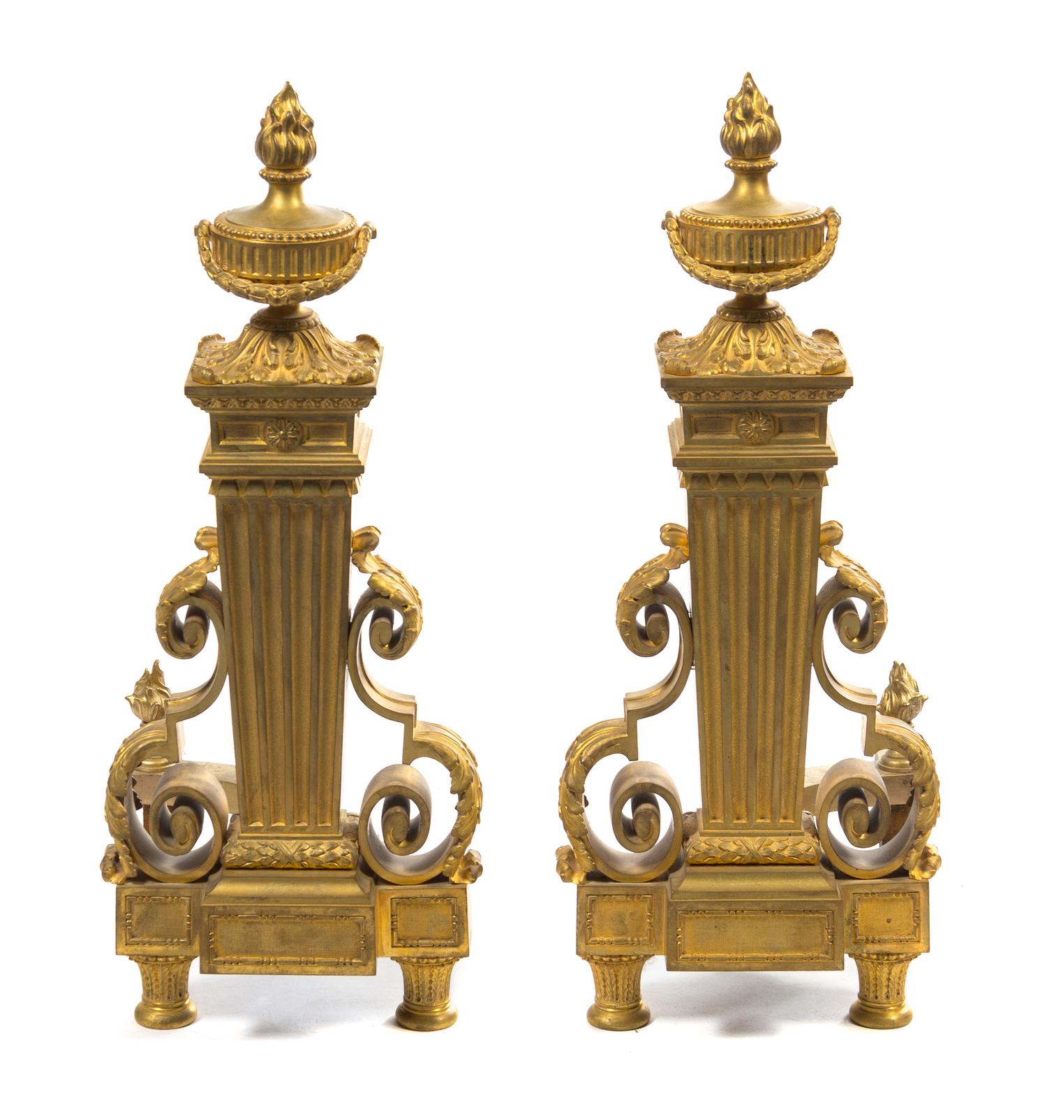 A Pair of Louis XVI Style Gilt Bronze Chenets Height 24 inches. — 19TH CENTURY