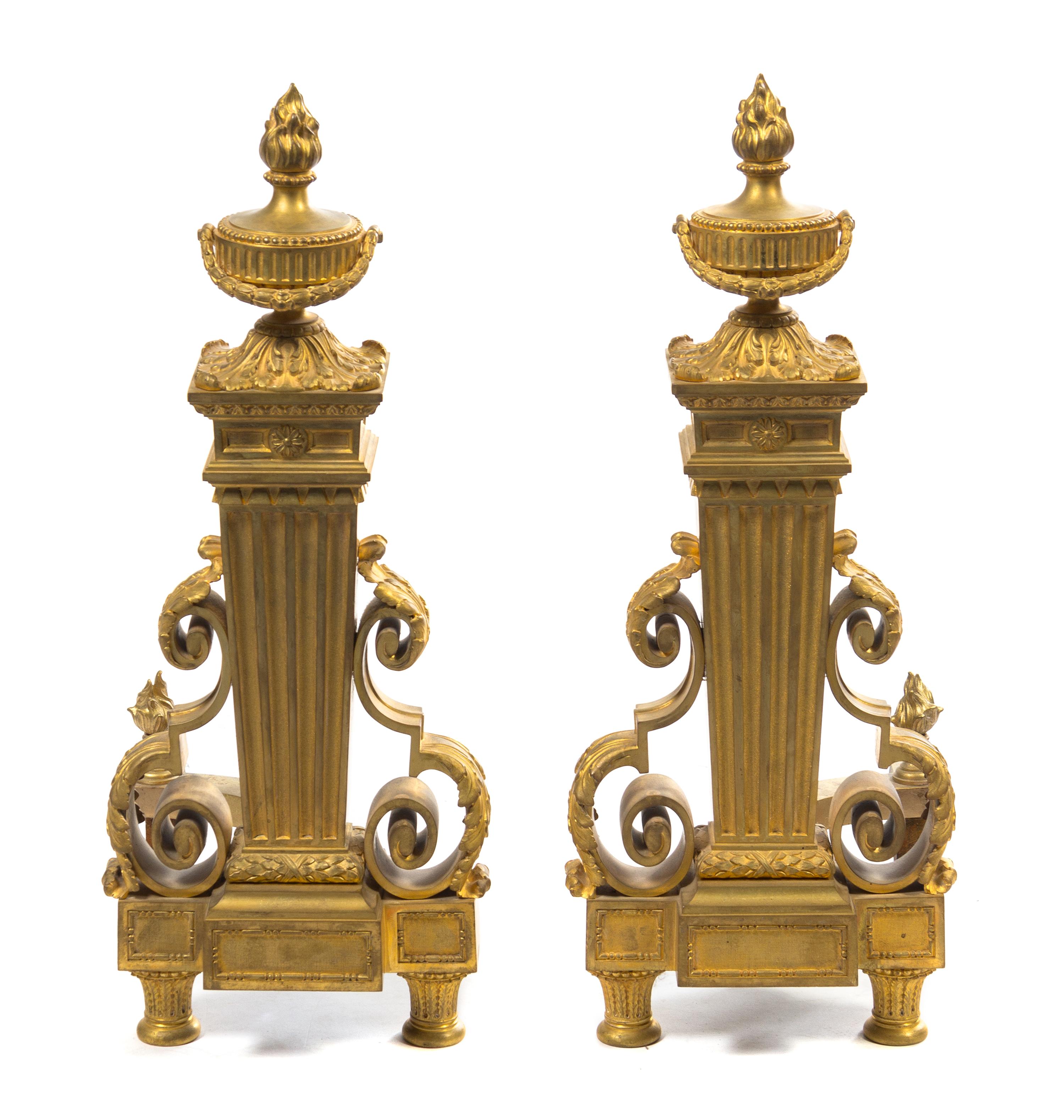 A Pair of Louis XVI Style Gilt Bronze Chenets Height 24 inches. — 19TH CENTURY