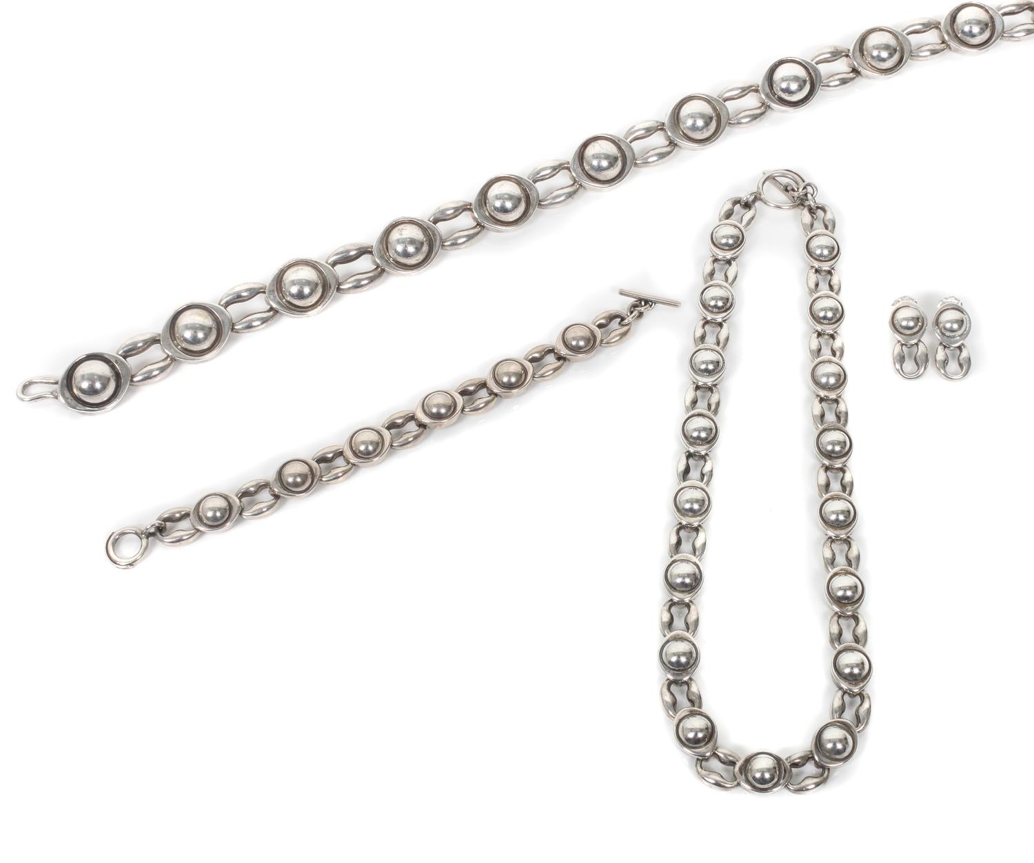 A James Reid, Ltd., Santa Fe, NM Sterling Silver Big Moon Suite Length of belt 41 1/2 inches.