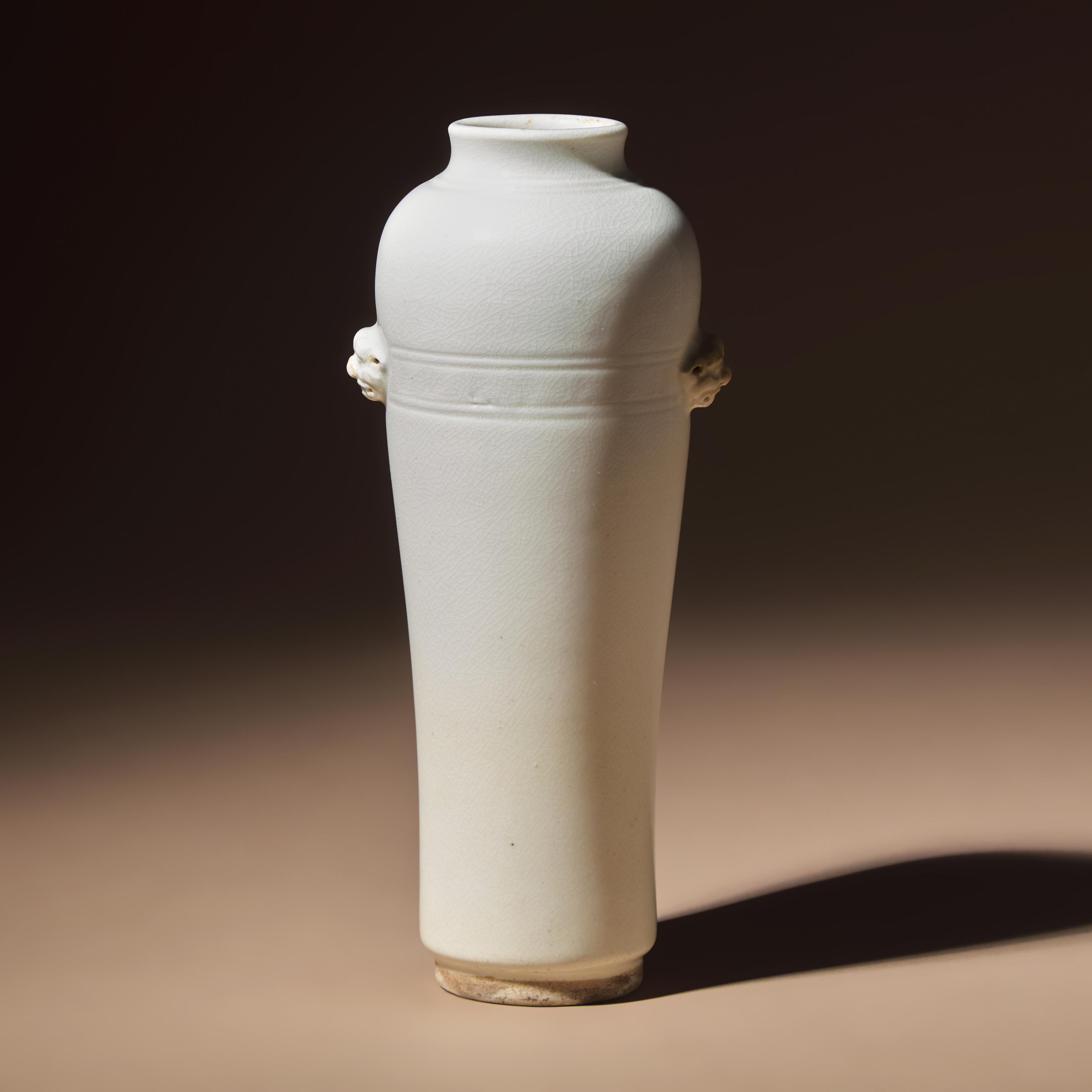A Chinese Blanc-de-Chine Porcelain Sleeve Vase, 17th-18th Century — 清早期 德化白瓷雙輔首耳弦紋筒瓶