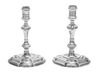 A Near Pair of George II Silver Candlesticks, James Gould, London, 1727 and 1736, each having a banded candle cup above a faceted, knop