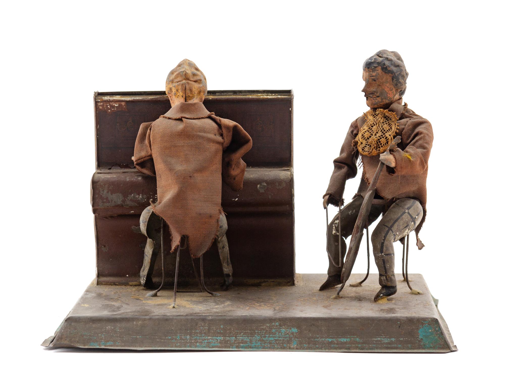 A Painted Tin Wind-Up "Two Musicians" Toy