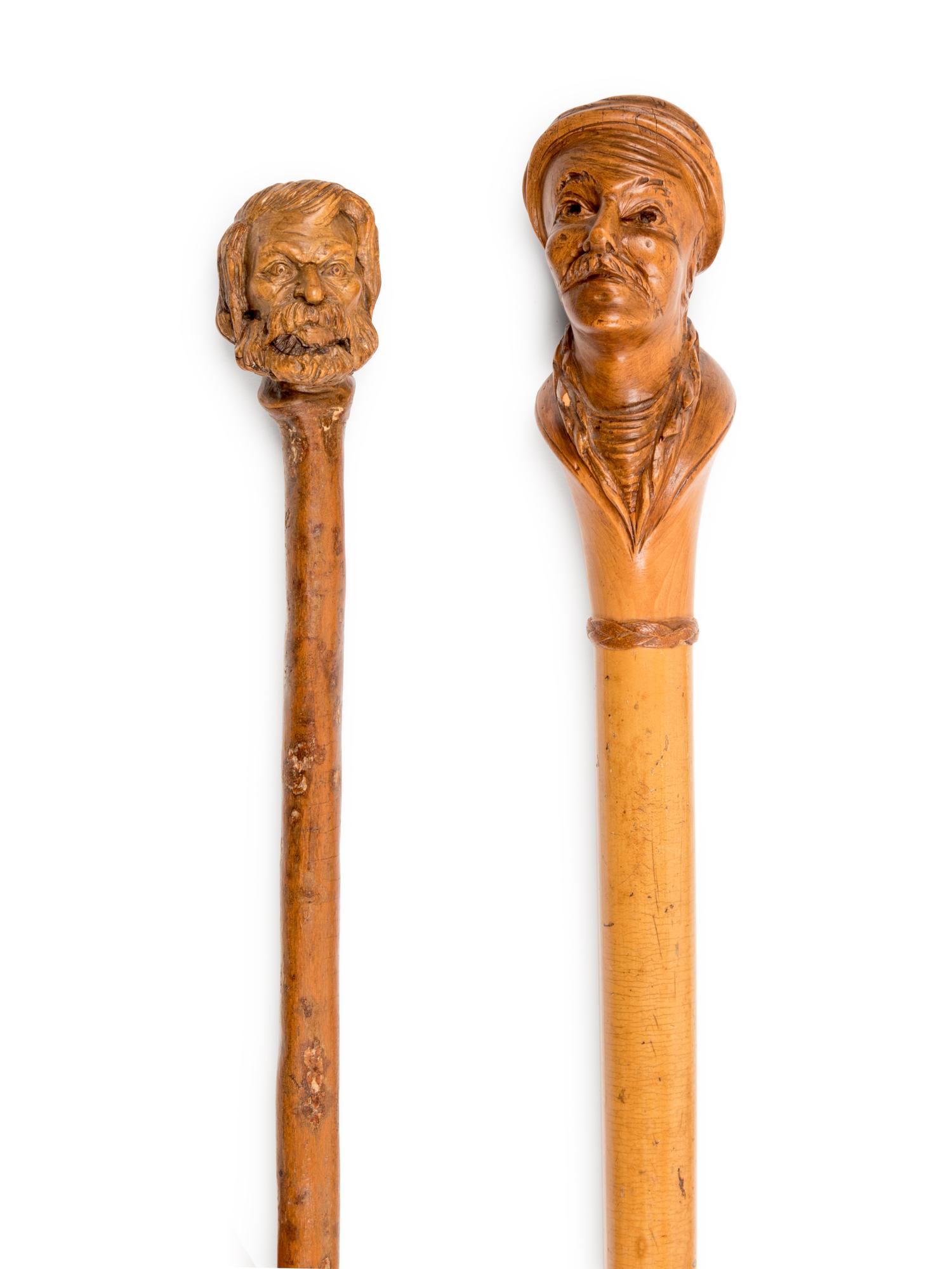 Four Figural Carved Wood Walking Sticks