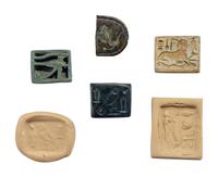 Four Egyptian Faience, Stone, and Metal Plaques with Hieroglyphs