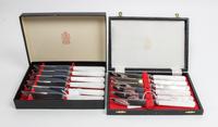 A Set of Twelve English Steak Knives, Kirk & Matz, Sheffield, having steel blades and simulated mother-of-pearl handles.