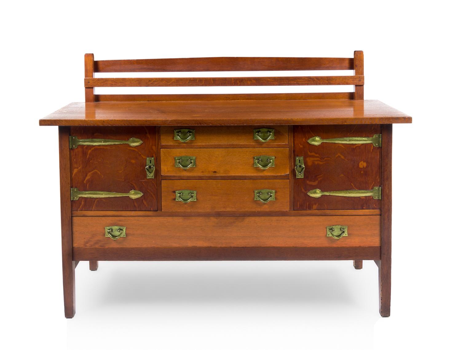 Gustav Stickley, (American, 1858-1942), an oak sideboard with smoked oak doors, model no. 814, having a rectangular top with back galle
