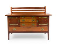 Gustav Stickley, (American, 1858-1942), an oak sideboard with smoked oak doors, model no. 814, having a rectangular top with back galle