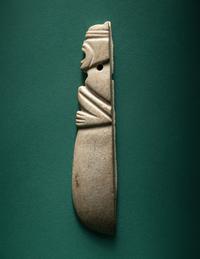 A Costa Rican White Jade Axe Pendant of a Crouching Monkey