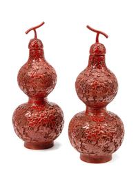 A Pair of Chinese Export Carved Red Lacquer Double Gourd Vases and Covers