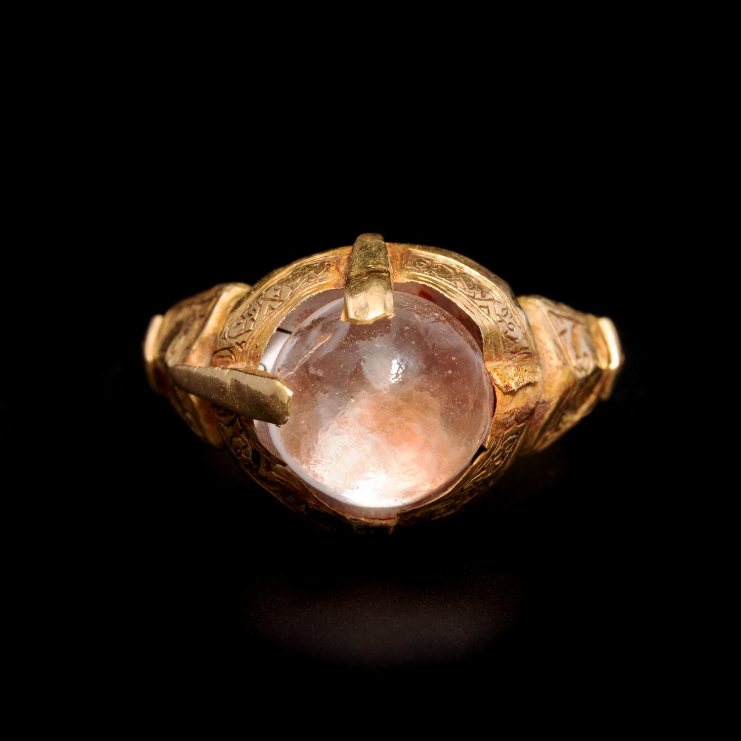 An Islamic Gold Finger Ring with Rock Crystal Cabochon