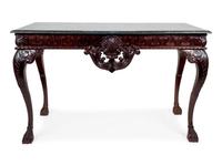 A George II Style Carved and Ebonized Console