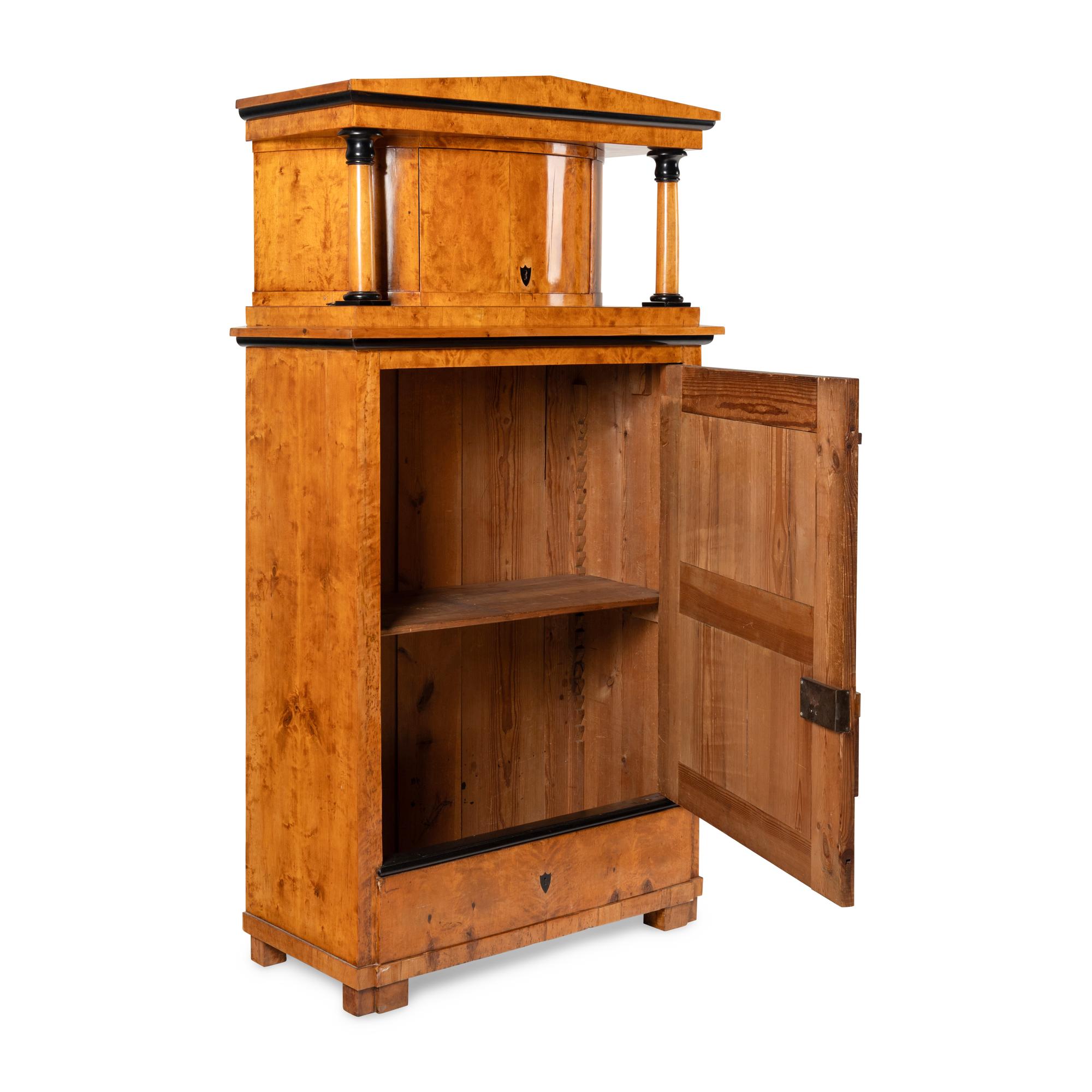 A Biedermeier Part-Ebonized Fruitwood Cabinet