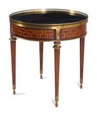 A Louis XVI Style Gilt Metal Mounted Marble-Top Mahogany Guéridon