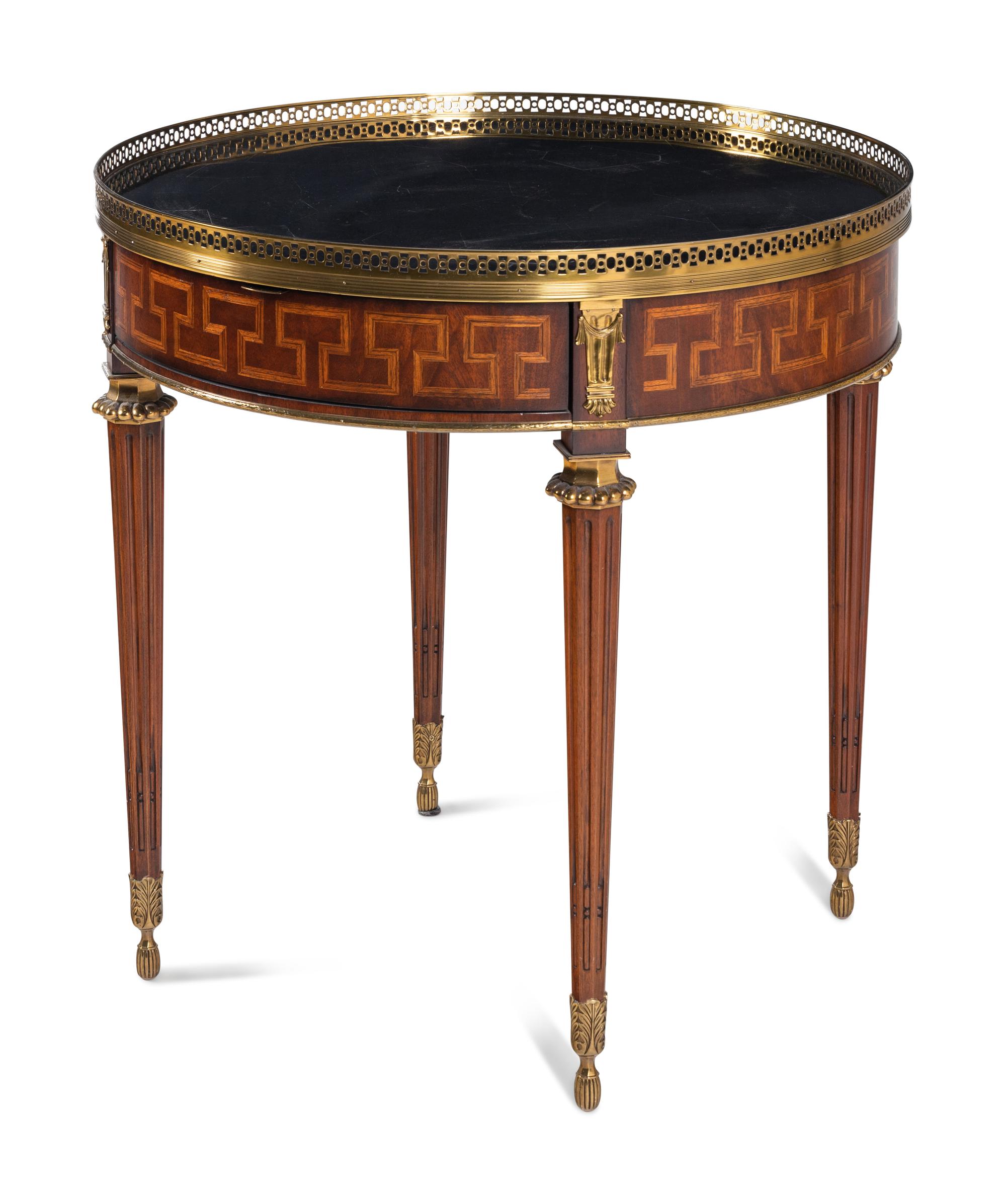 A Louis XVI Style Gilt Metal Mounted Marble-Top Mahogany Guéridon