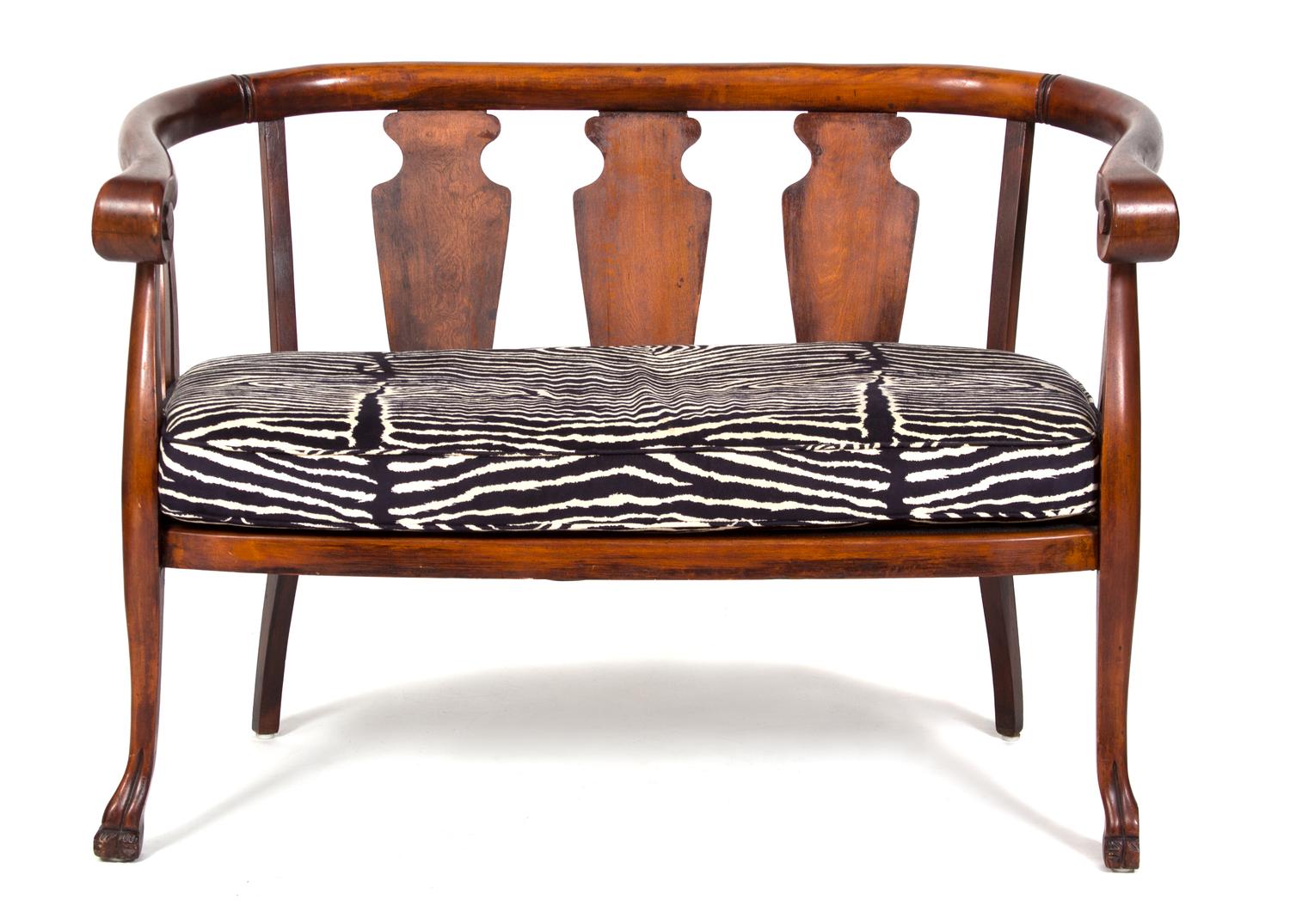 A British Colonial Mahogany Loveseat and Barrel-Back Rocking Chair Height of loveseat 32 x width 45 x depth 23 inches. — 20TH CENTURY