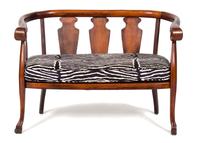 A British Colonial Mahogany Loveseat and Barrel-Back Rocking Chair Height of loveseat 32 x width 45 x depth 23 inches. — 20TH CENTURY
