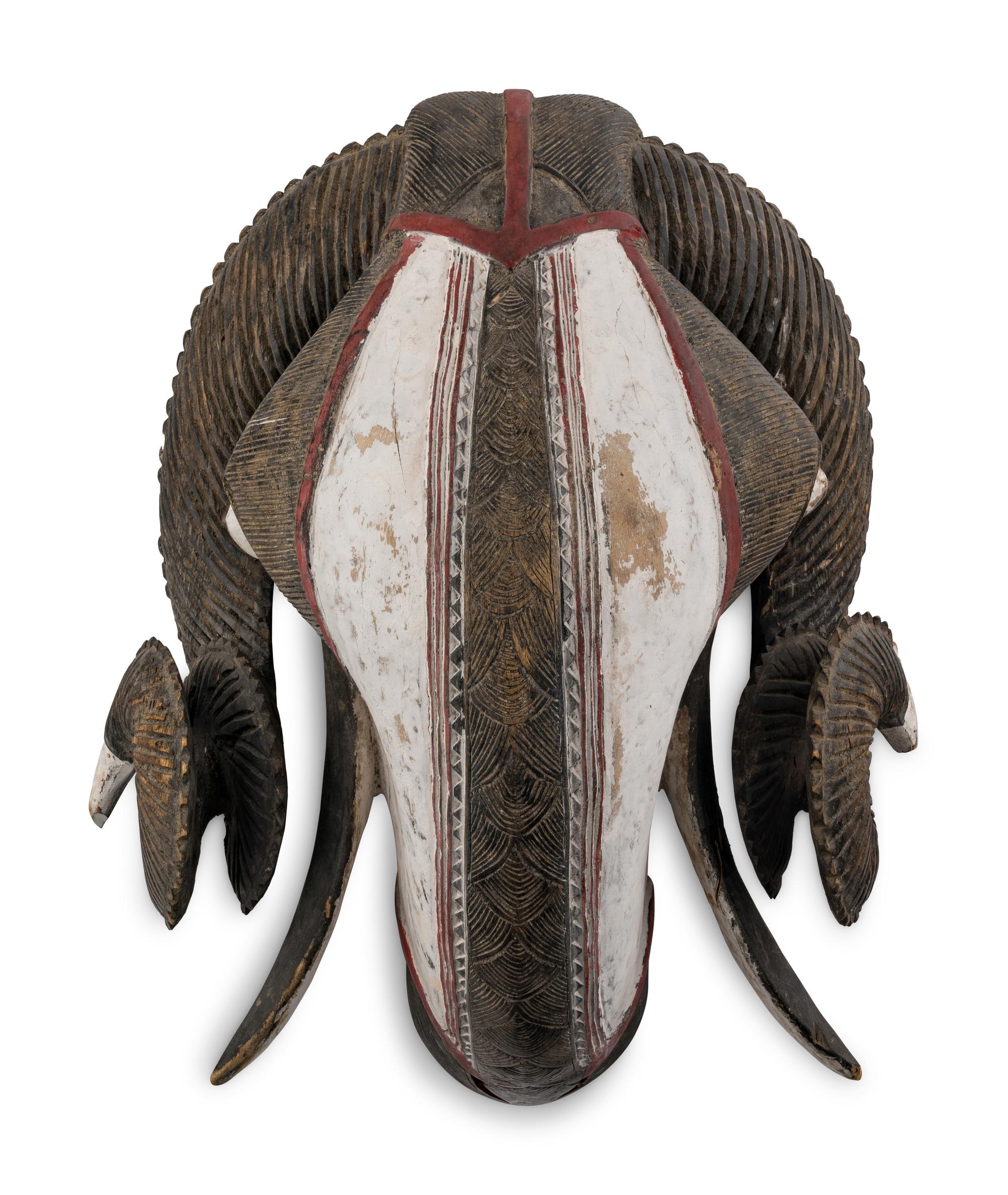 An African Carved and Painted Wood Ram's Head