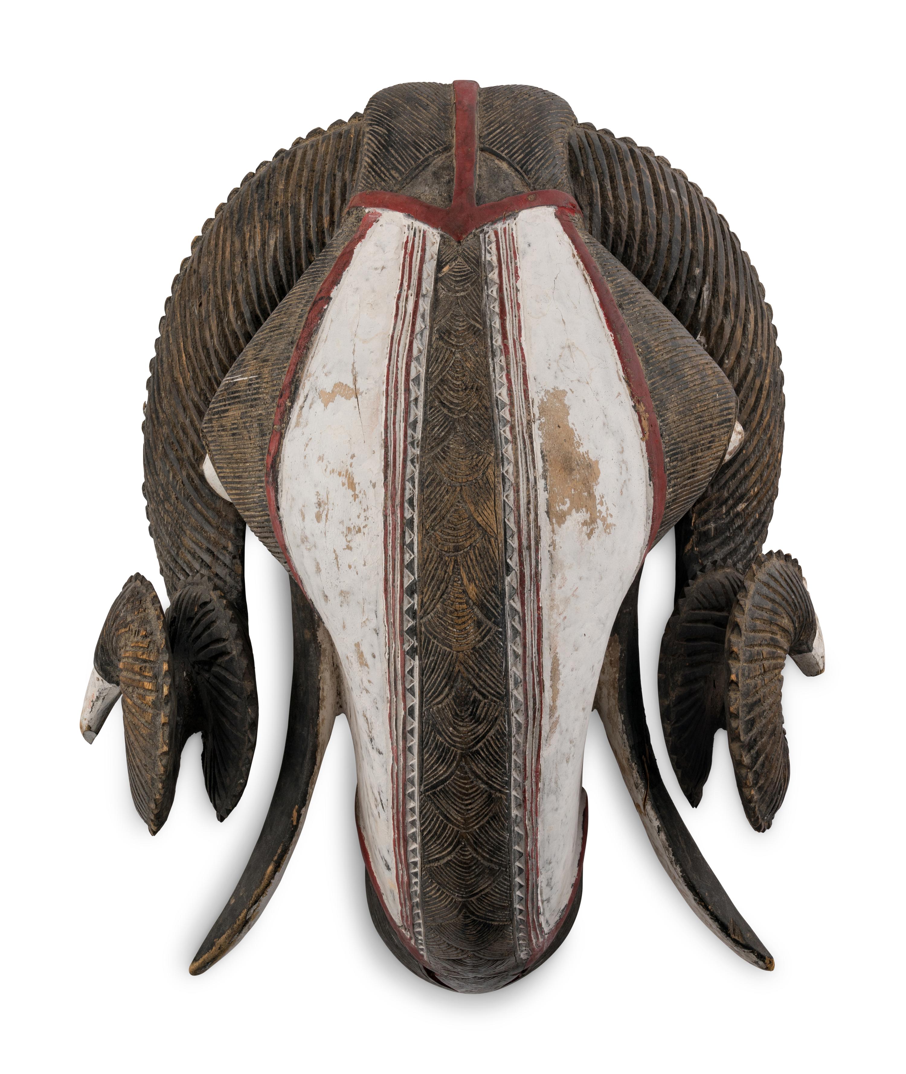 An African Carved and Painted Wood Ram's Head