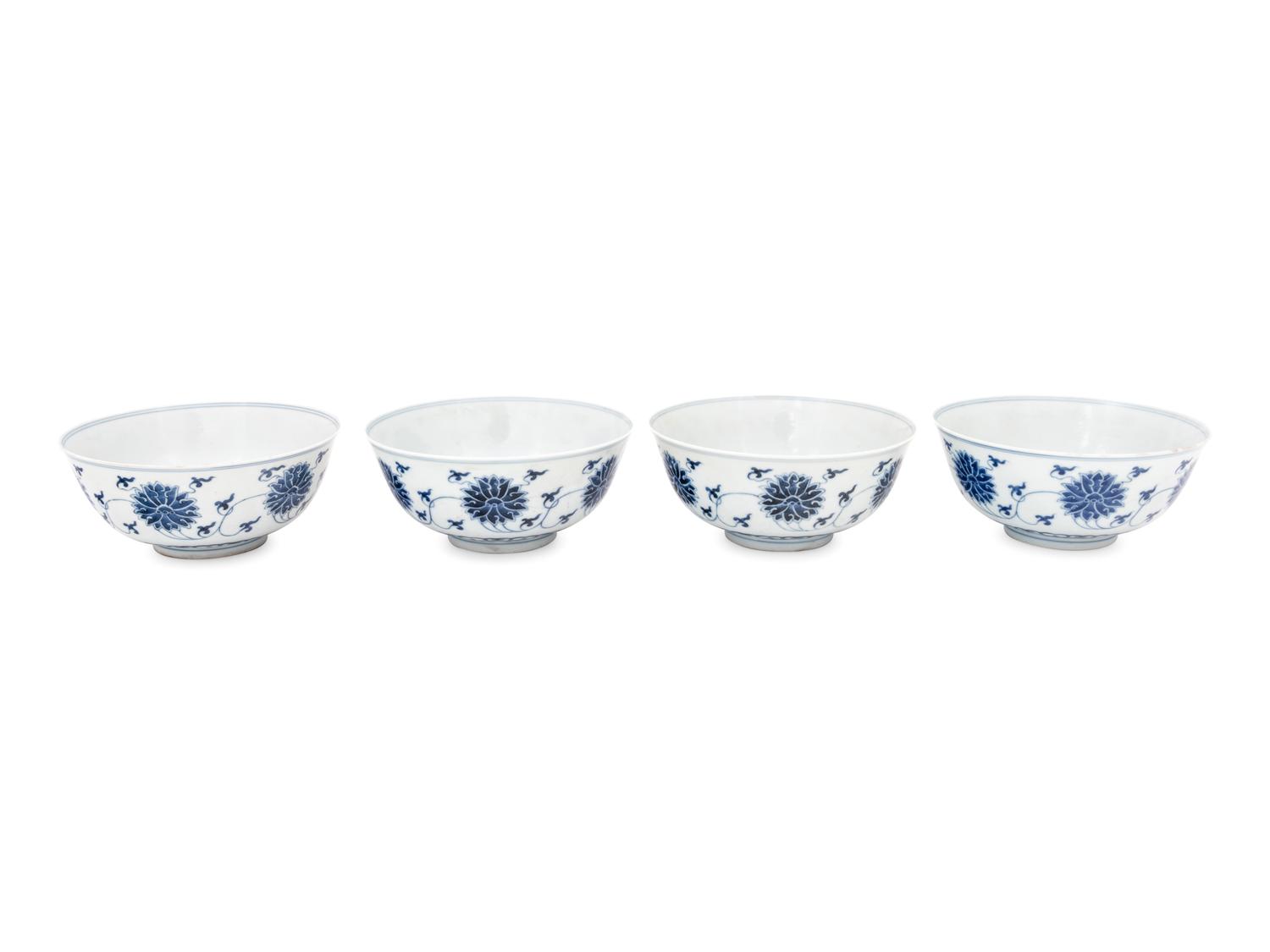 Four Chinese Blue and White Porcelain 'Lotus' Bowls
