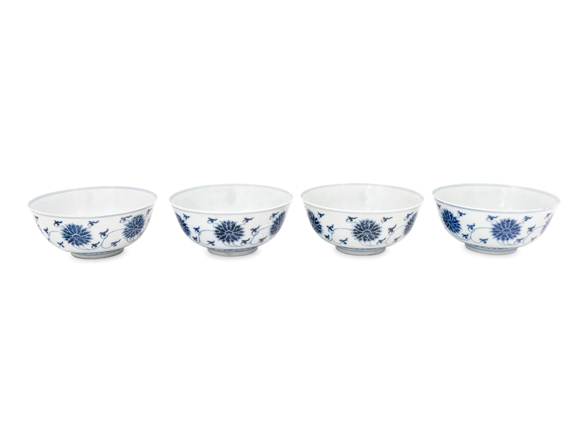 Four Chinese Blue and White Porcelain 'Lotus' Bowls